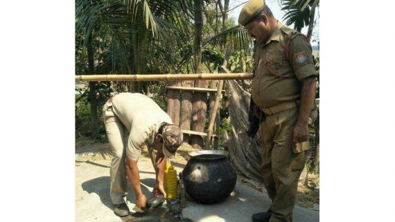 22 illicit liquors being destroyed.