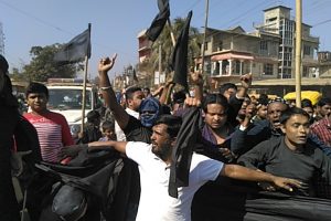Demostrators protesting against Sushmita Dev and later burning effigy of her in Silchar's Madhurband on Sunday