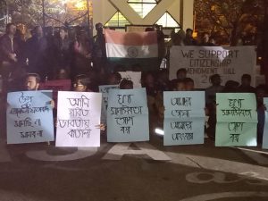 Students of Assam University hold placards all written in Bengali on Thursday evening for support of Citizens Amendment Bill