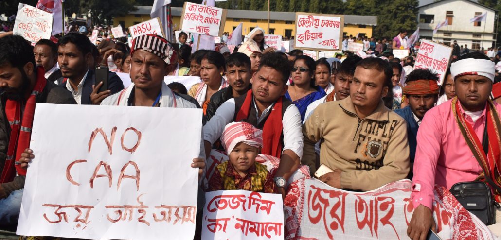 Protesters holding placard in Tangla during anti-CAA protest. Image: Northeast Now