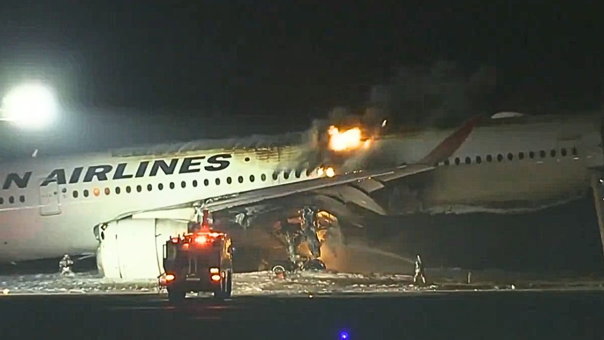 Japan Airlines plane with 367 onboard catches fire on runway at Tokyo ...