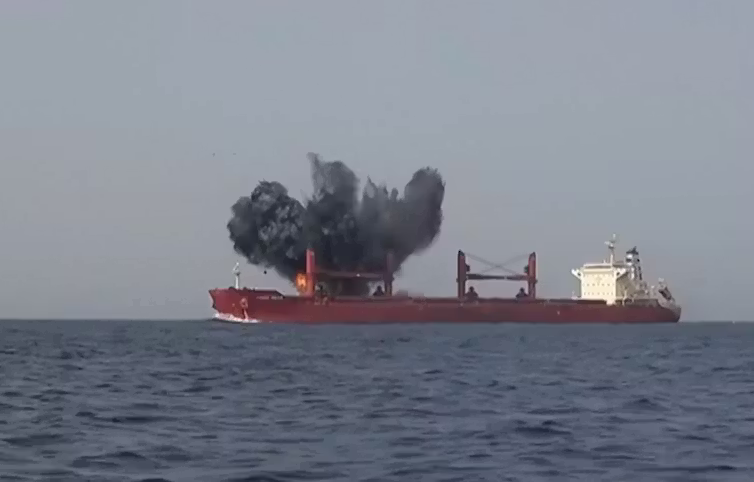 An explosion hits a commercial ship.